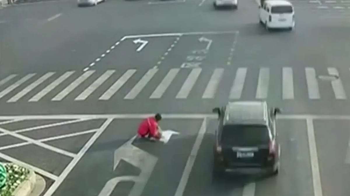 Man Hand Raised Chinese man fed up with his commute painted his own road sign
