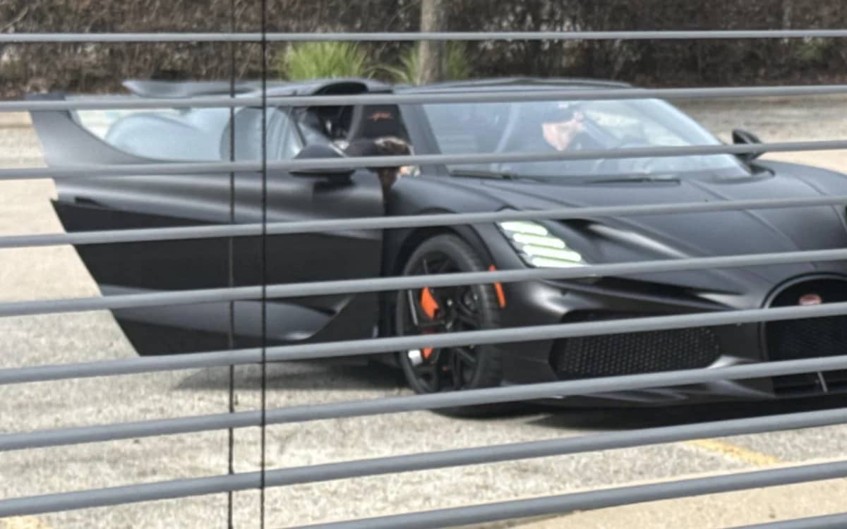 supercar-parked-outside-office-window-regret