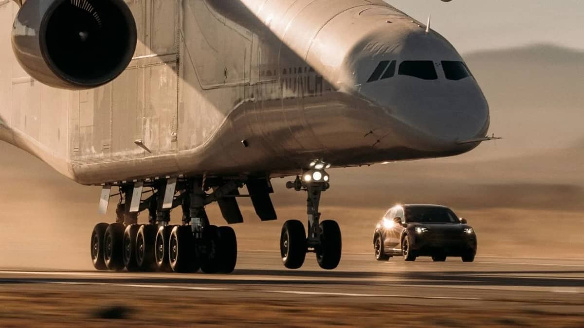 Most powerful production Porsche sets a new record after driving under world's biggest aircraft as it takes off and lands
