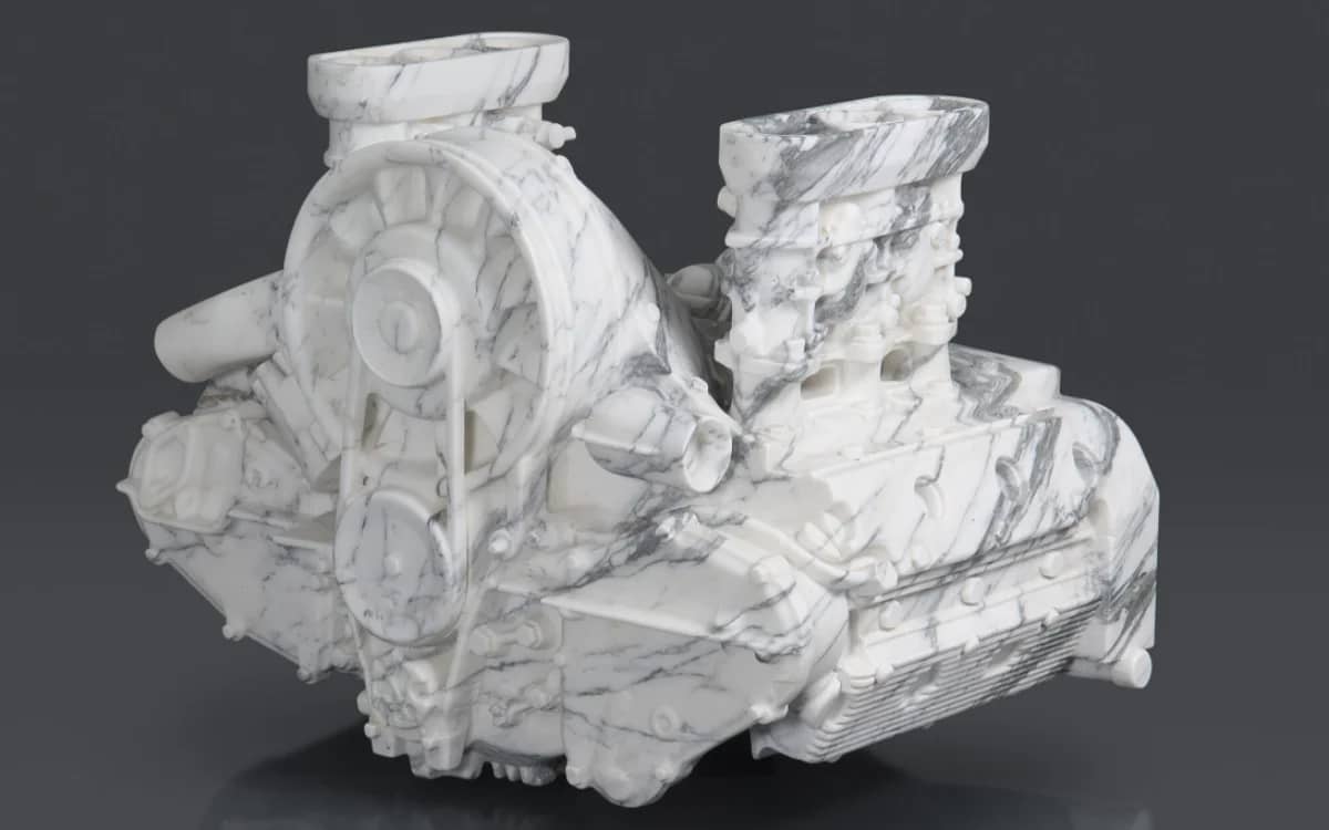 artist-carving-life-sized-marble-porsche-911