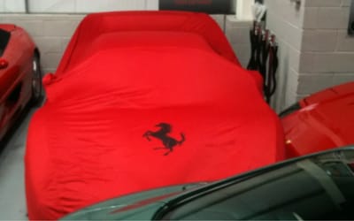 Ferrari's first EV spotted out in public in thick camouflage that makes it look utterly bizarre