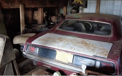 A 1971 Plymouth Barracuda was found abandoned in a barn after years sitting in cow dung