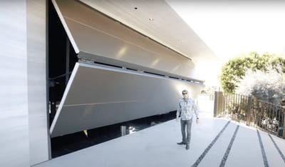 Mega-mansion’s $350,000 garage door costs more than the Ferrari inside