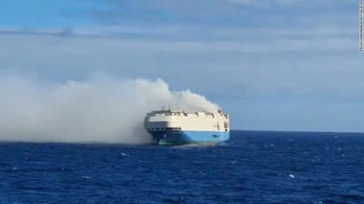 A cargo ship full of Porsches is on fire in the middle of the ocean