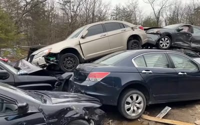 Man exploring abandoned junkyard amazed by the kind of things people leave inside cars