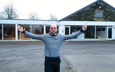 man-buys-abandoned-saab-dealership-dream-garage