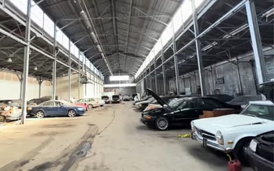 Guys wandering around Connecticut find a huge warehouse full of abandoned rare cars and motorbikes