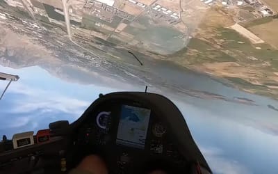 Glider pilot does unplanned air show performance and wows crowd but ends up losing his license