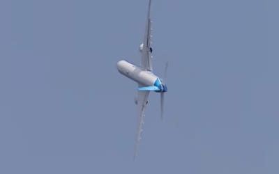 Boeing 777X banks so steeply it looks like it's defying gravity and frozen in the air