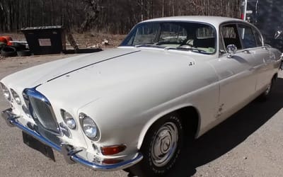 Guy discovers unexpected secret hidden in classic Jaguar abandoned for over 30 years