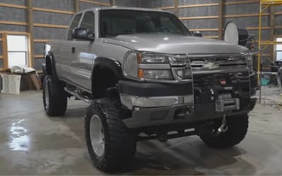 Humongous abandoned Chevy monster truck is so dusty after 12 years in a barn the color is unrecognizable