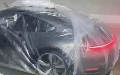 Way of protecting Porsche 911 in flooded parking lot leaves Reddit users divided over whether it’s genius or absurd