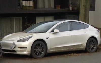 Canadian residents puzzled over a mysterious Tesla collecting parking tickets, unmoved from the street for months