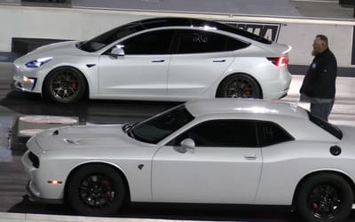 White Mopar and a white Tesla meet for a nail-biting neck-and-neck battle in Las Vegas drag race