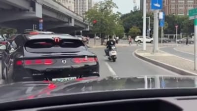Chinese car uses its 'crab walk' feature to allow vehicle to pass by it in smoothest way possible