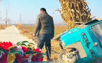 Stranger in China tips his own vehicle sideways to save a couple's wedding luck on a narrow road