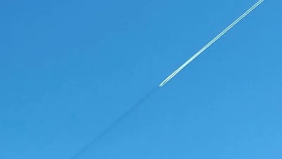 Couple baffled after spotting surreal phenomenon with line showing in front of plane — and ask what's causing it