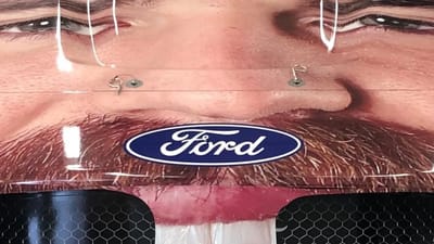 NASCAR driver Corey LaJoie became the first driver to cover the entire front of their car with their own face in a very surreal sponsorship deal
