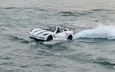 Cristiano Ronaldo shows off the most bizarre vehicle in his collection as he drives a sports car over the sea