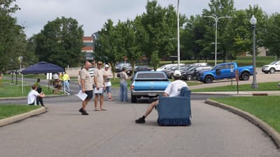 motorized-living-room-couch-car-show-porsche-owner-angry