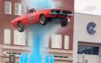 Iconic Dukes of Hazzard General Lee car flies through the air as it jumps Kentucky fountain