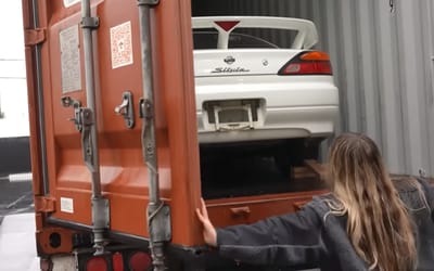 Woman finally takes delivery of her dream car after 8-year search led to finding it 'frozen in time' hidden in storage container