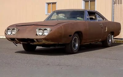 Father and son wait decades for Plymouth Superbird after hearing urban legend a scary man in town had one