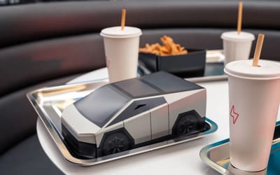 Burgers in Cybertruck boxes and robot popcorn at Tesla’s diner but not everyone’s impressed