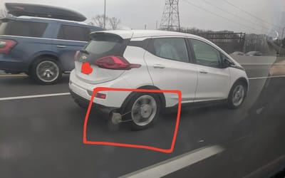 Expert reacts to genius Chevy Bolt driver attaching belt to rear wheel and generator to charge its battery while driving