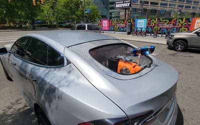 us-man-warped-adds-gas-engine-to-his-tesla-american-road-trip