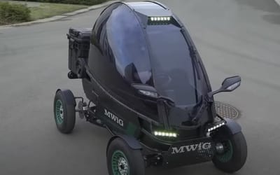 The smallest electric car in the world is no bigger than a bicycle and can be taken in an elevator