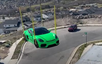 Porsche supercar craned onto mansion roof during house party