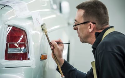 This man reportedly earns a six-figure salary just drawing 5-meter lines on Rolls-Royces