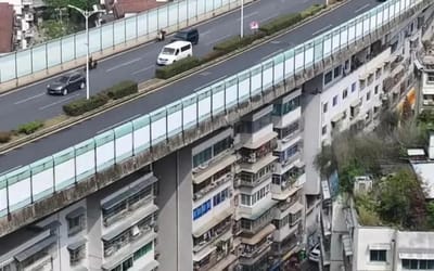 block-of-apartments-in-china-under-a-highway