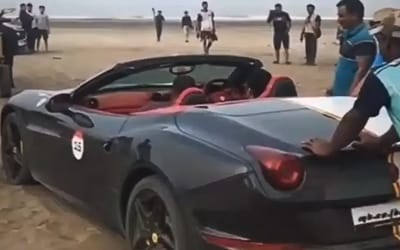 $350K Ferrari California T stuck on a sandy beach in Mumbai has been rescued in the most bizarre way