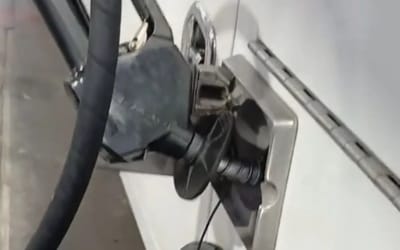 Man goes viral for trick to fix gas pump nozzle randomly clicking but not everyone is impressed