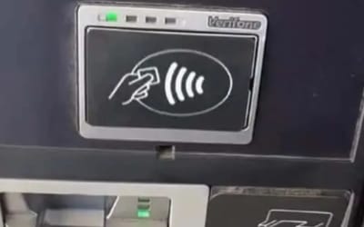 us-man-sticker-card-reader-gas-credit-card-scam-warning