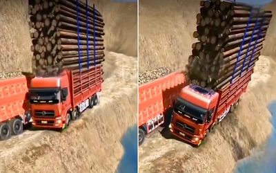 Watch this logging truck miraculously stay on all four wheels on the edge of a cliff