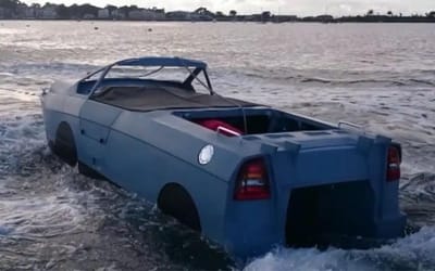 Man heads to a harbor to test his homemade amphibious car