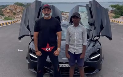 Man lets kid pose in front of his McLaren 720S so he can show it off in school