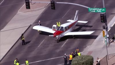 Breathtaking surveillance footage shows small Piper plane miraculously landing on a main street in Arizona