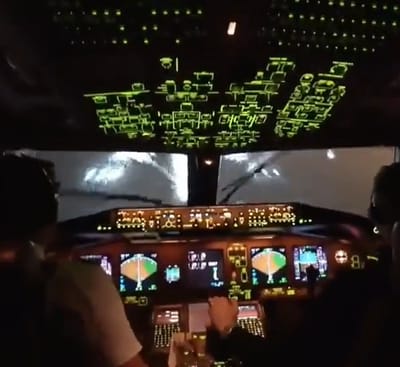 Spectacular cockpit view of a Boeing 777 landing amidst torrential rain