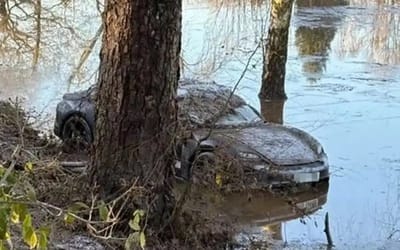 A frozen Porsche Taycan discovered washed up on a golf course after floods