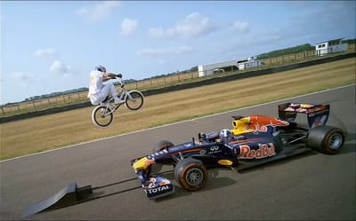 Hair-raising clip shows pro BMX rider jumping over moving F1 car in world first