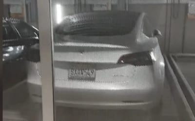 Woman paid ‘$400-$600’ to park in a stacker garage and was then confused after her car got stuck under a Tesla