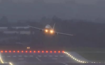 Wild footage shows Embraer E190 having to abort landing because the stormy winds are too strong