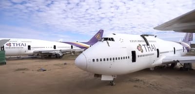 Man visits a desert location in California where aircraft go to die and explores Thai Airways plane to find nostalgic items from the 70s and 80s