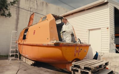 The grandson of a pioneering scuba diving legend is spending an entire year circumnavigating the coastline in a converted lifeboat to save the ocean