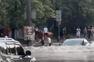 tesla-model-3-driving-flooded-street