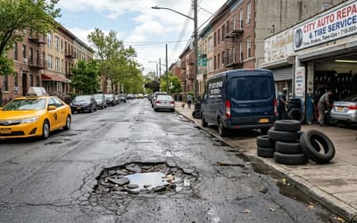 Resourceful 23-year-old mechanic is making $2,200 every night setting up shop next to a single pothole in New York City